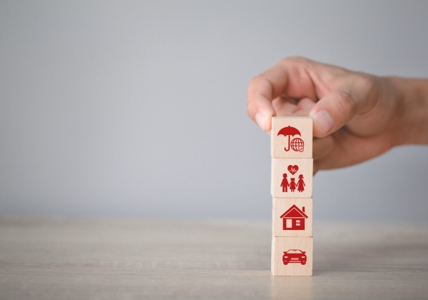 Hand arranging wood block stacking with icon insurance: car, Hand arranging wood block stacking with icon insurance: car,